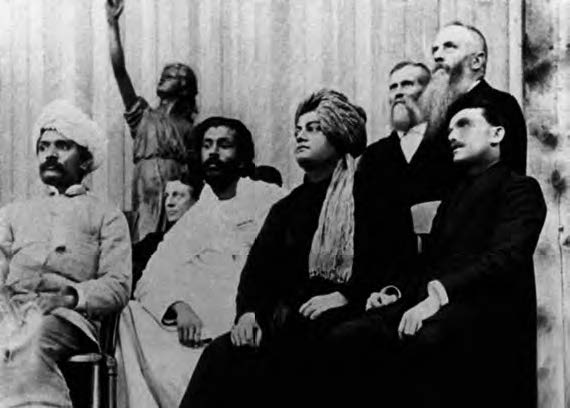 A group of men from different religious backgrounds stand in a line for a photograph. 