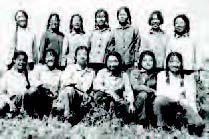 a group of girls stand for a photograph