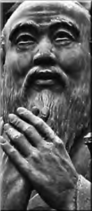 photo of a statue of a bearded man praying