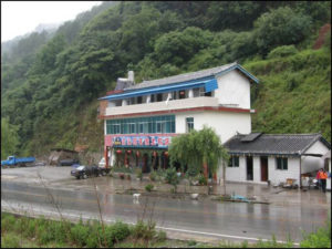 photo of a two story building with red lettering on the outside