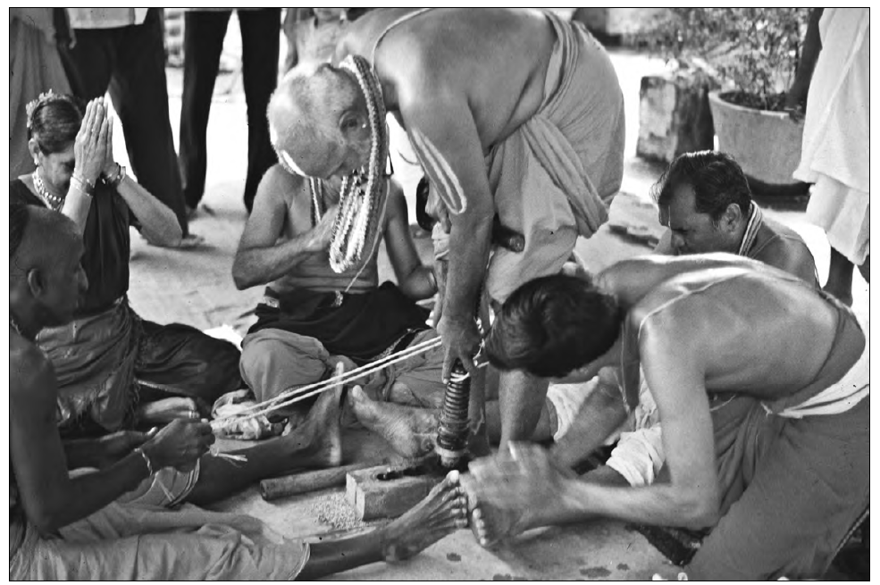 image of an old man showing several others