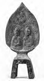 an altar shaped like a teardrop with two sitting buddha figures engraved into it