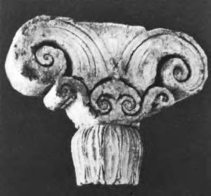 photograph of an ionic capital (the top of a pillar) that is swirly at the ends