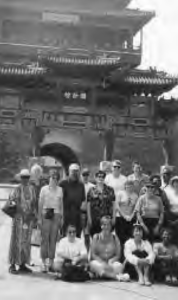 a group poses in front of a temple