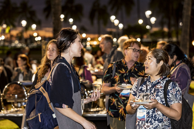 A photo of attendees at the 2022 AAS Annual Conference talking at the opening reception.