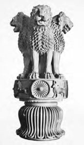 photo of three lions (statues) sitting on a pillar