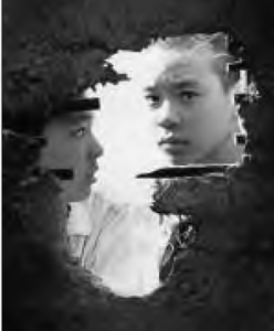 two boys look through a hole in the wall