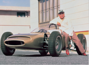 photograph of a man and a four wheeler.