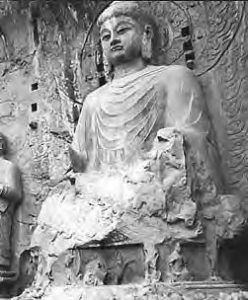 statue of a buddha carved into rock