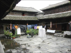 view of a courtyard with laundry hanging to dry