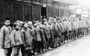 Image shows many child beggars standing on the street