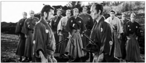 Image shows two samurais facing each other, and a group of samurais behind them