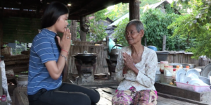 A Cambodian woman being interviewed by her niece.