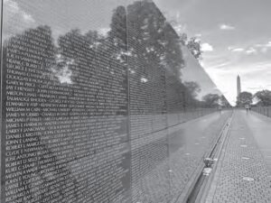 photo of a long wall of names in small writing.