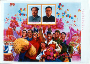 image of a family holding flowers and a bushel of wheat celebrating with the images of two men in the middle