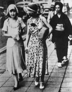 Two young Japanese women in modern fashion