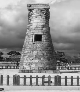 photograph of a bottle-shaped tower with a single window.
