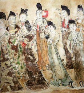 A painting depicting Tang Dynasty court ladies wearing multicolored dresses engaged in conversation. The vibrant and ornate dresses showcase the fashion of the time, while the interaction among the court ladies reflects the social dynamics and refined culture of the Tang Dynasty in ancient China.