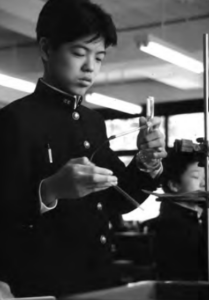 Photo of a boy who doing science experiments