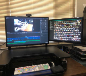 The author edits a documentary on his computer video editing setup.