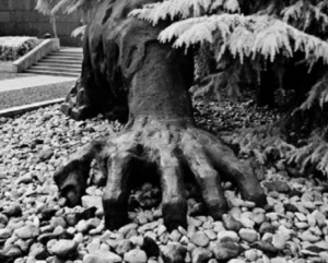 A sculpture of hand coming out of the ground