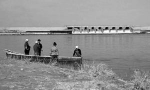 A small fisherman boat with four fisherman on the North Aral Sea near the Kokaraul Dam in Kazakhstan.