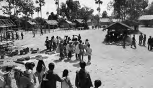 The Ung family, along with hundreds of others, arrive at a Khmer Rouge labor camp.