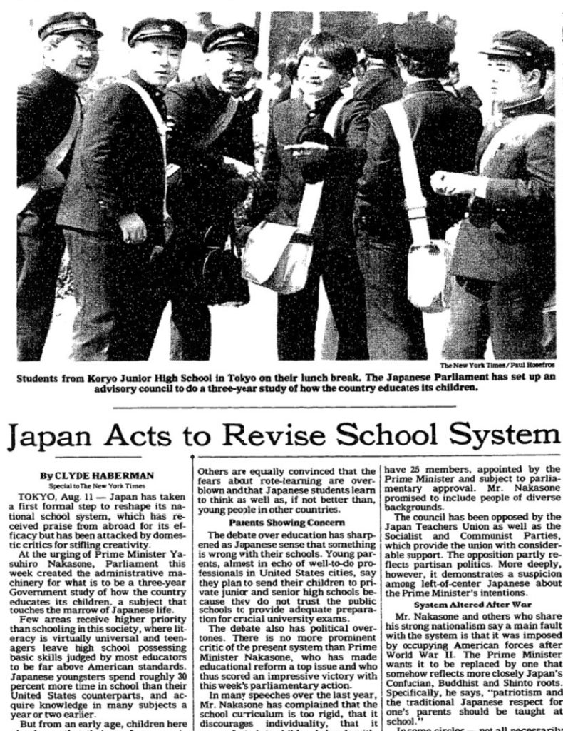 newspaper front page showing an article titled Japan acts to revise school system, with a photo of young boys in school uniforms