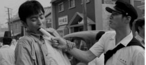 Screen capture shows a man struggles to eat a popsicle