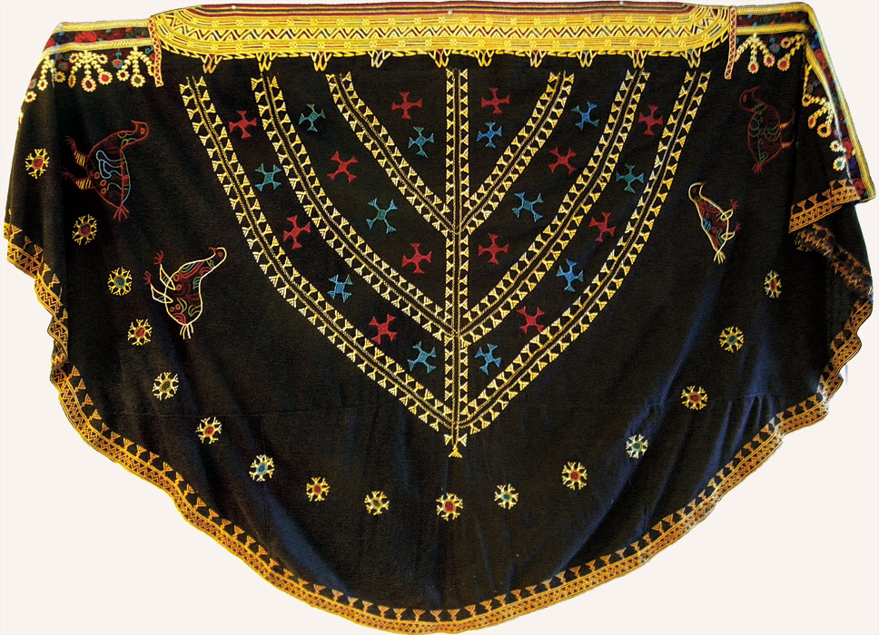 a robe with elaborate patterns, including bird motifs