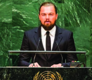 A photograph of Leonardo DiCaprio addressing a crowd at a UN environmental meeting in 2020. 