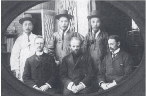 black and white photograph of several men in formal wear. 