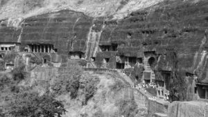 photo of a bunch of caves carved into the mountainside