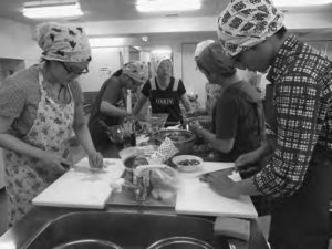 several people doing cooking prep