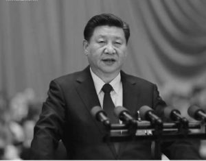 Xi Jinping delivers the “mother of all reports” at a podium in the 2017 19th National Congress.