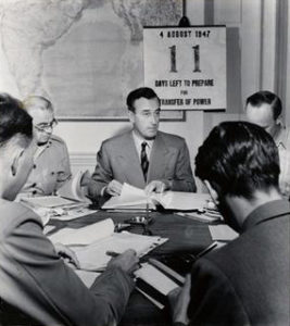 Image shows five officers meeting in the room