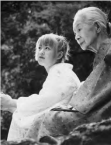 Photo of young girl and old woman in traditional Japanese costume