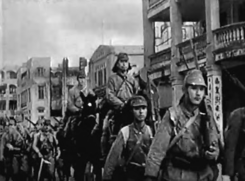 Imperial Japanese Army personnel marching through Manila, Philippines, 1944.