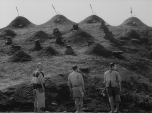 The samurai survivors pay homage to the graves of their fallen brethren.