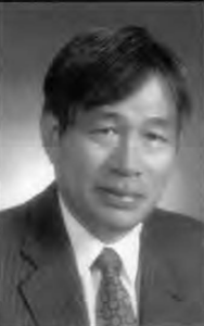 Photograph of a middle-aged Asian man wearing a business suit and tie.