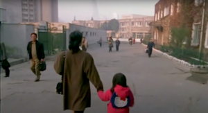 Mrs. Hong walking her daughter to school.