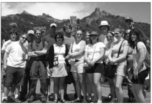 Photo of a group of people in front of the Great Wall