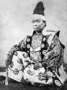 a man in finely decorated robes. 