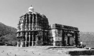 photo of a temple made from stone. it looks like the temple is made of ridges, like that would be made from water erosion