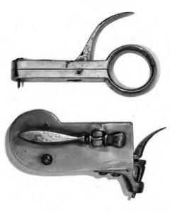 photograph of the instrument from two angles. it shows a circle and small claw like appendage