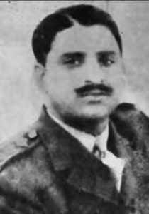 black and white photograph of a mustached man