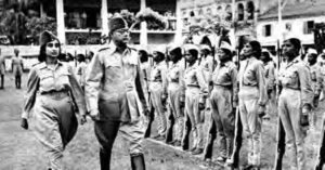 black and white photo of several women in a line in uniform