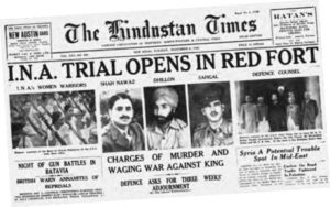 photograph of a newspaper with the headline "INA trial opens in red fort"