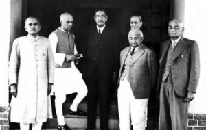 photograph of several men in dress suits standing together