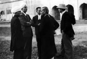 photograph of several men in suits standing together